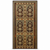 Dark cedar Moroccan double door with ornate gold-tone geometric and floral metal inlay