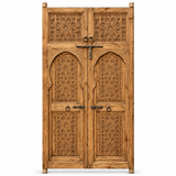 Natural wood Moroccan double door with geometric carving, horseshoe arches, and forged iron hardware