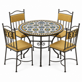 Zellige mosaic dining table set with four amber cushioned iron chairs, cobalt blue and honey gold tile pattern