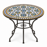 Round zellige mosaic dining table with cobalt blue white and honey gold star pattern tile top and dark wrought iron scrolled base