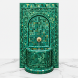 Emerald green Moroccan mosaic fountain on white marble - clean studio product shot