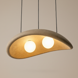 Close-up of the Obriy clay pendant lamp showing its handcrafted texture and warm glow