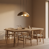 Obriy clay pendant lamp hanging above a minimalist Japandi dining table