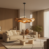 Sculptural wooden pendant light glowing in a warm modern living room