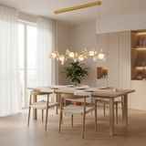 Nordic gold petal shell pendant light above a Scandinavian dining table