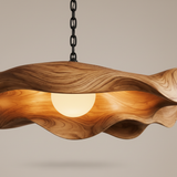 Low-angle detail of the wooden pendant light showing its warm illuminated underside