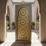 Brass and engraved metal Moroccan door installed in a sophisticated riad courtyard