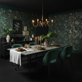 Olive gold moss zellige mosaic rectangular dining table in a dark maximalist botanical interior with forest green walls brass chandelier forest green velvet chairs and bronze tableware