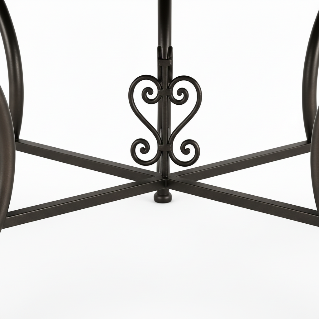 Dark bronze-black wrought iron table base with curved splaying legs X-cross stretcher brace and ornate heart-shaped scrolled motif at center junction
