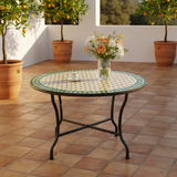 Zellige mosaic table styled on a sunlit Mediterranean terrace