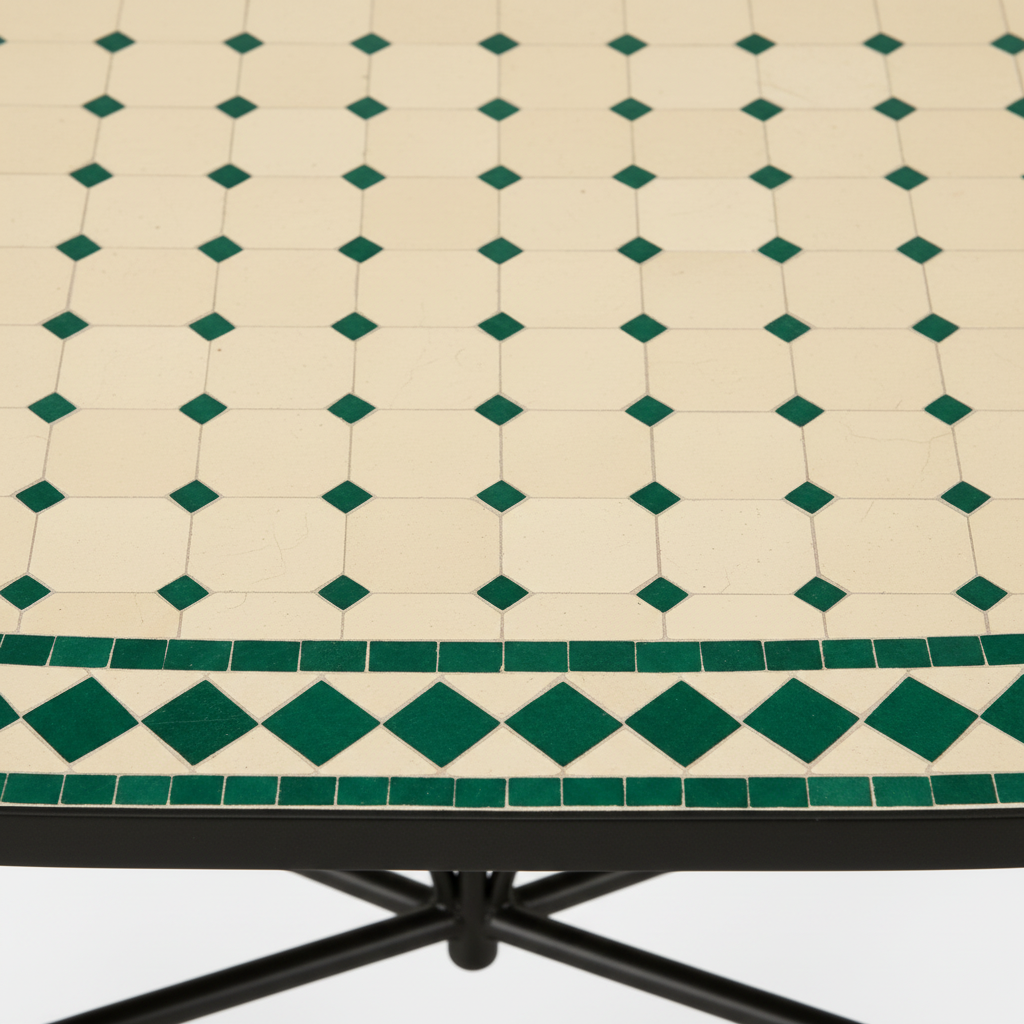 Close-up macro of ivory cream zellige mosaic tiles with small deep emerald green diamond dot accents and alternating ivory and green diamond border