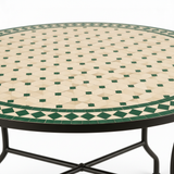 Close-up of cream and emerald green zellige mosaic tile pattern
