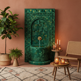 Green Moroccan mosaic fountain installed indoors in luxury living room with rattan and candles