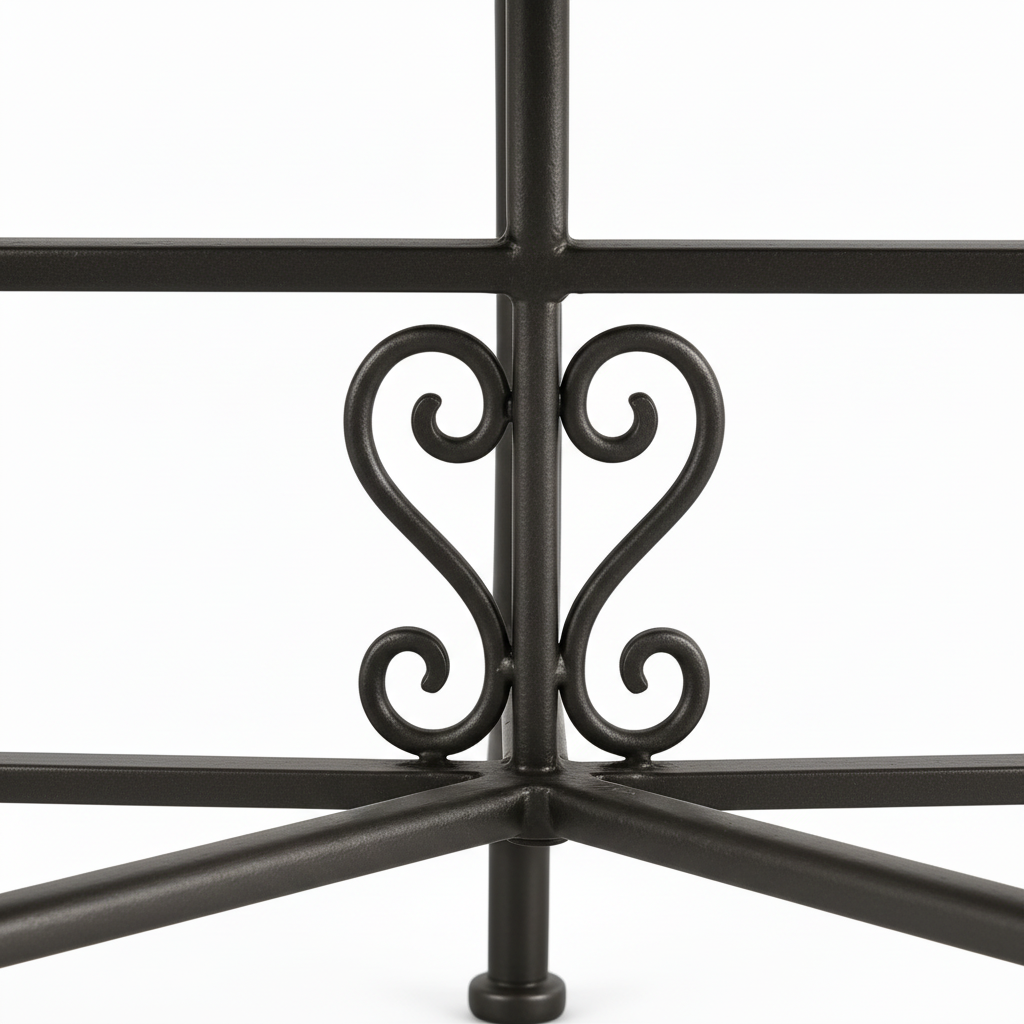 Hand-forged dark wrought iron table base with ornate scrollwork heart decoration and curved legs