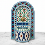 Moroccan blue arch mosaic fountain on white marble - clean studio product shot
