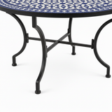 Dark matte black wrought iron table base with curved outward-splaying legs and flat X-cross stretcher brace detail
