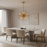 Polished brass Sputnik chandelier above a modern dining table