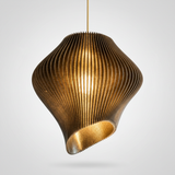 Three-quarter detail of the smoke black wave pendant light glowing warmly