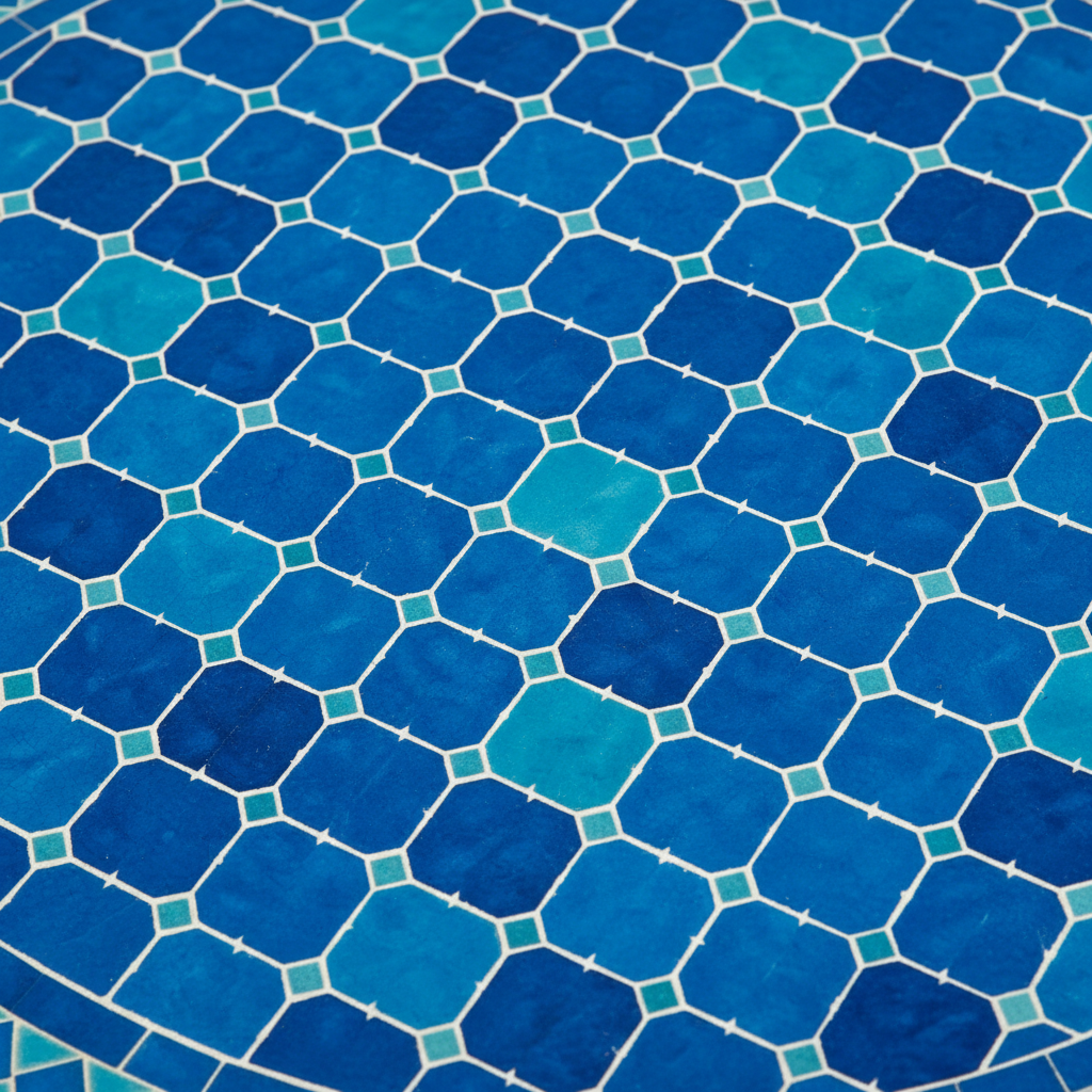 Close-up macro of vivid cobalt blue and teal zellige mosaic basketweave tile pattern